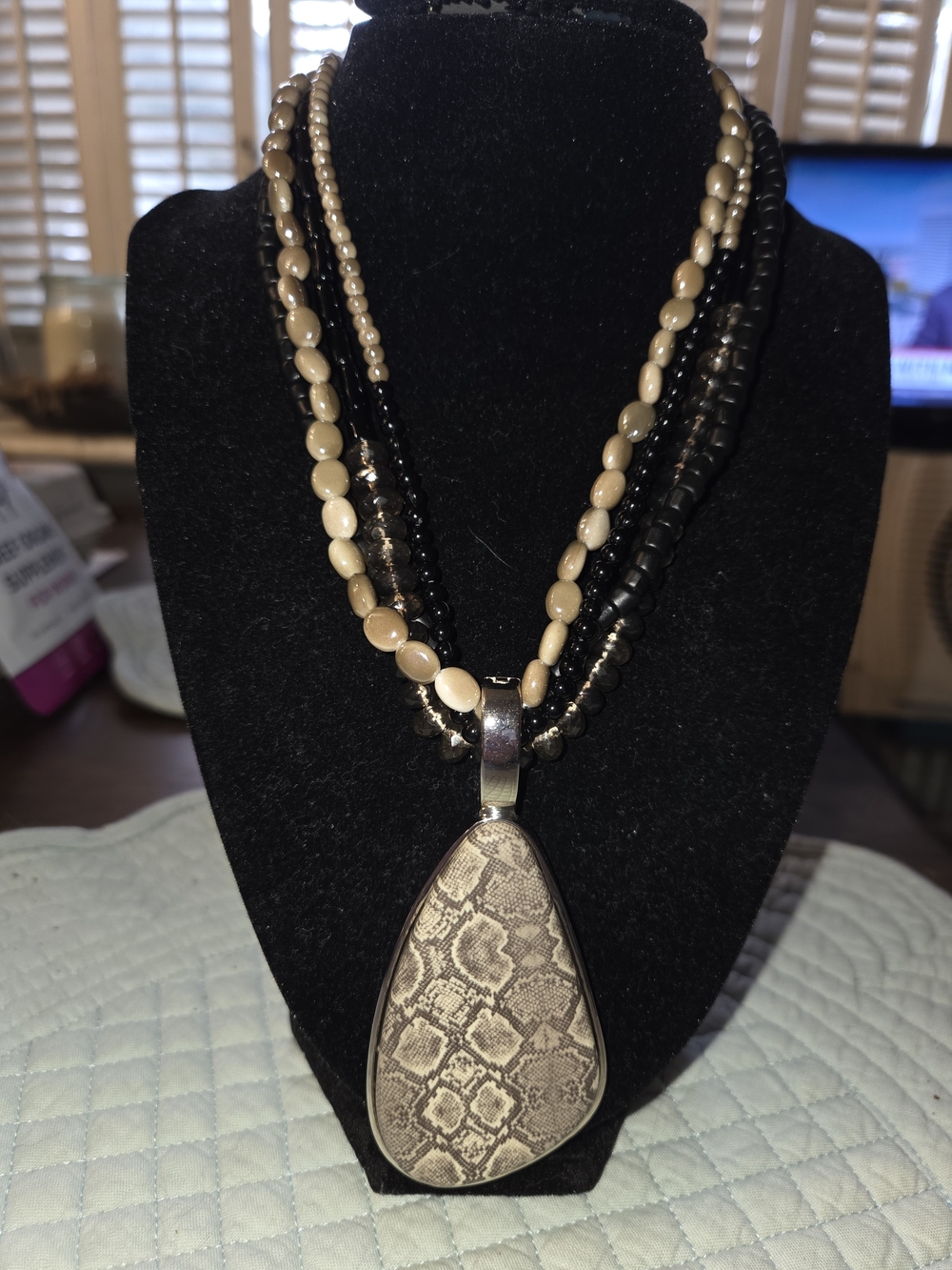 Beige and Black Multi-Strand Pendant Necklace with Snake-Print Teardrop